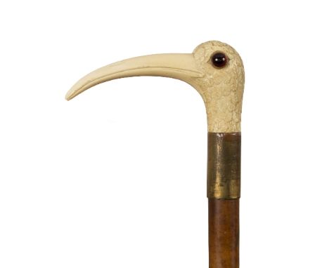 A malacca walking stick, the ivory handle carved a curlew head with glass eyes/see illustration Condition Report: This lot co