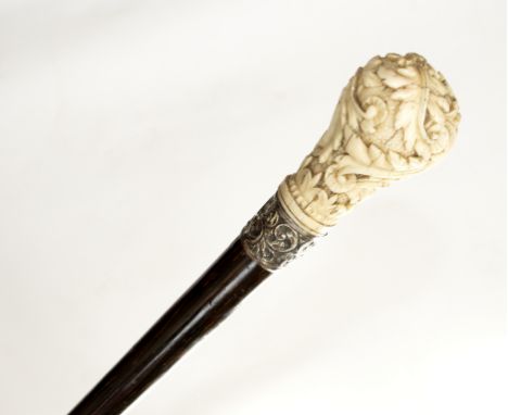 An simulated rosewood walking stick with embossed silver collar and ivory handle carved acanthus leaves/see illustration Cond