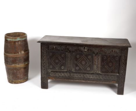 A 17th Century triple-panel carved oak coffer (alterations) and a coopered stick stand, the coffer 117cm wide Condition Repor