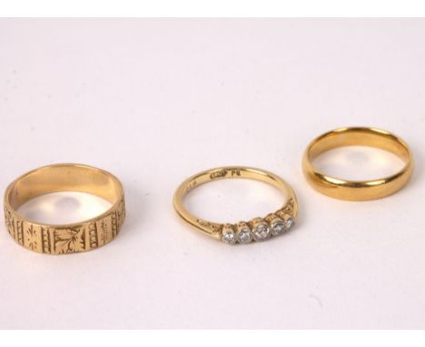 A diamond five-stone ring set in yellow gold, a 22ct gold wedding band and an 18ct gold wedding band