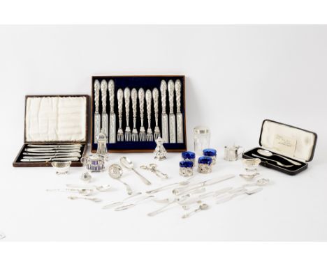 A quantity of silver to include a boxed Christening spoon and fork, cruets, caddy spoons etc.