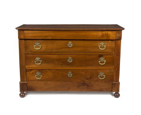 A French walnut commode of 18th Century design, fitted three drawers with ormolu ring handles, on bun feet, 130cm wide/see il