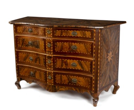 An early 18th Century Maltese olive wood and parquetry serpentine commode, the cross banded top inlaid two stars with similar