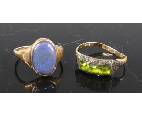 A 9ct gold black opal set dress ring, sponsor TB, size J/K, together with a yellow metal and green hardstone set band ring, u