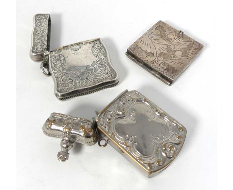 An Edwardian silver vesta case, of shaped rectangular form, William J Holmes, Birmingham 1903, 0.9ozt; together with a silver