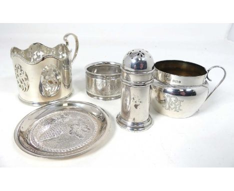 A George V silver beaker mount, of cylindrical shape, having a wavy rim, flying scroll handle and pierced detail; together wi