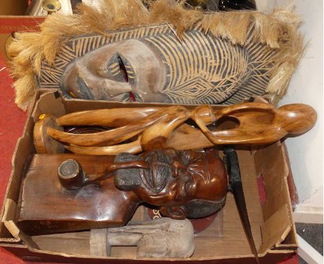 A collection of tribal wares to include a carved hardwood bust of a gentleman smoking a pipe, height 44cm, and a carved softw