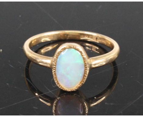 A 9ct gold cabochon opal set dress ring, opal measures approx 9x6mm, size M, 1.9g