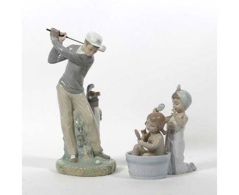 Two Lladro porcelain figures ' Bathing Beauties' no.06457, 'Jugador ge golf' no.4824', both with boxesBoth in good condition.