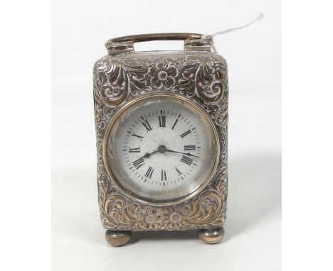 A circa 1900 silver cased minuet carriage clock having white enamel Roman dial, keywind movement, height 8cm (handle down)Sev