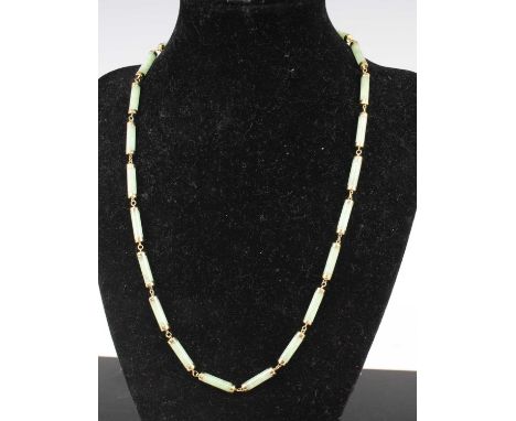 A modern Chinese polished celadon jade and a 14ct gold necklace, 48cm, 17.8g