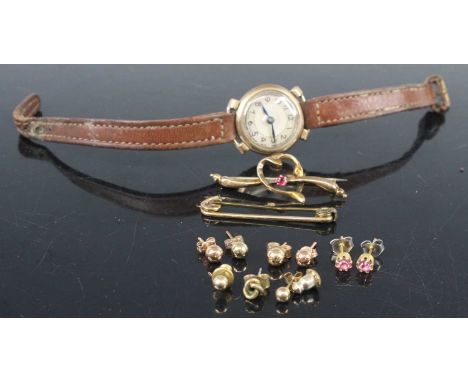 A lady's vintage 9ct gold cased manual wind wristwatch, together with assorted principally 9ct gold ear studs, safety pin bar