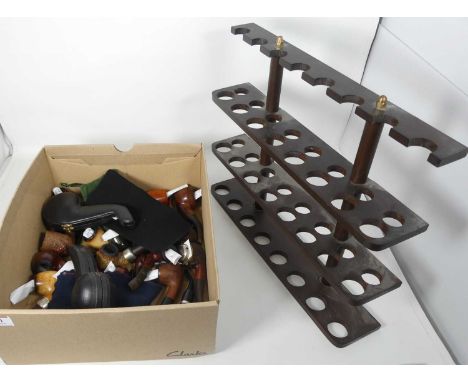 A collection of various briar pipes, and a pipe rack