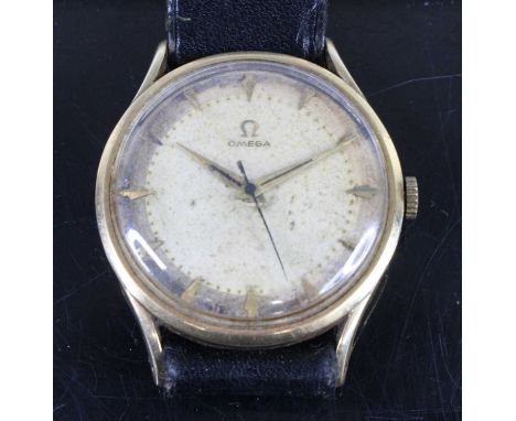 A gent's Omega 14ct gold cased manual wind wristwatch having singed champagne dial with baton markers (grubby and tarnished) 