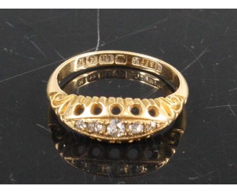 A Victorian 18ct gold diamond five stone ring, total diamond weight estimated approx 0.09ct, Birmingham assay, size K, 3g