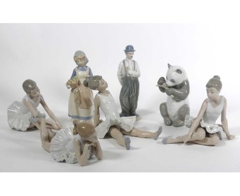 Four Nao porcelain figures of ballerinas, each model seated together with three further Spanish porcelain figures (7)Panda wi