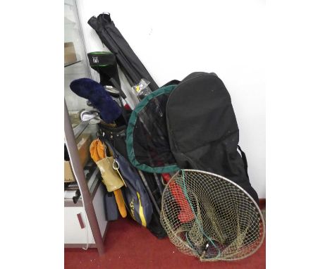 A collection of fishing equipment to include nets, and other sporting equipment to include golf clubs