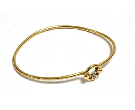 9CT GOLD &amp; DIAMOND BANGLE 1.8mm round, solid wire bangle, with spring hook clasp secured into a round brilliant cut diamo