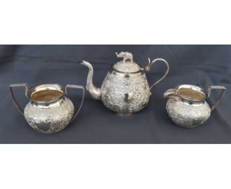 ANTIQUE INDIAN SILVER TEA SERVICE intricately embossed with jungle scenes depicting lions, peacocks, elephants, hares and gaz