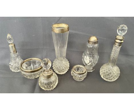 ANTIQUE SILVER MOUNTED CUT GLASS ITEMS Variously hallmarked and to include, a bud vase, cosmetic pots, scent bottles with fac