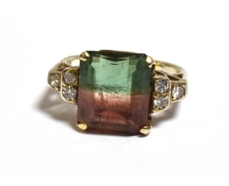 A WATERMELON TOURMALINE &amp; DIAMOND RING Mounted in 18ct gold (tests as), claw set with an octagonal step cut tourmaline, a