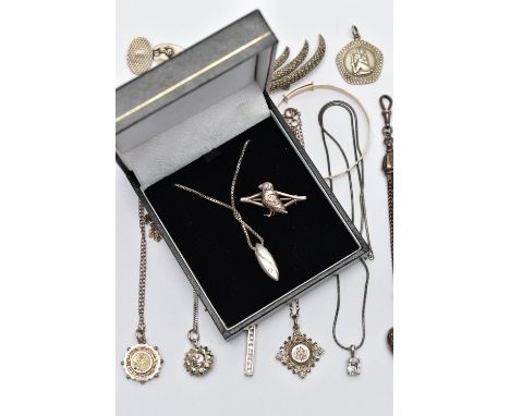 A SELECTION OF SILVER AND WHITE METAL JEWELLERY, to include a silver Victorian pendant of a circular form decorated with a ye