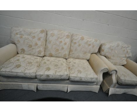 A BEIGE UPHOLSTERED THREE PIECE LOUNGE SUITE, comprising a three seater sofa and a pair of armchairs (3)