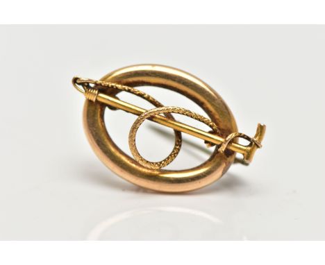 A LATE VICTORIAN HUNTING BROOCH, of an oval openwork form, displaying a riding crop and rope, approximate dimensions length 3