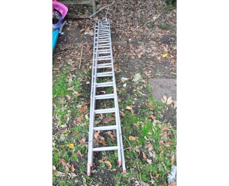 AN ALUMINIUM DOUBLE EXTENSION LADDER with 15 rungs to each 4m section along with a Standoff