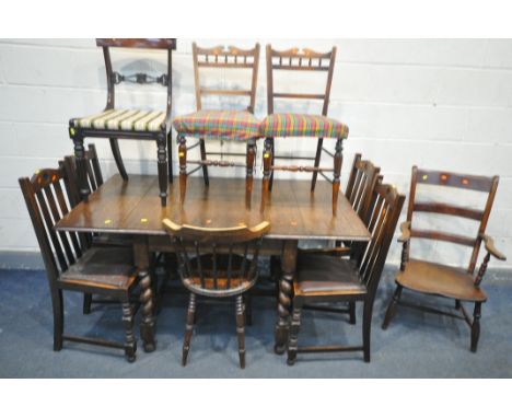 A 20TH CENTURY OAK BARLEY TWIST DROP LEAF DINING TABLE, united by a H stretcher, along with four oak chairs, a ladder back op