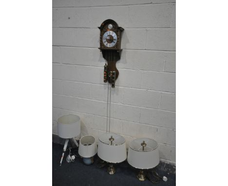 A TEMPUS FUGIT DUTCH WALL CLOCK, the seven inch dial with roman numerals, two brass weights and a pendulum, along with a pair