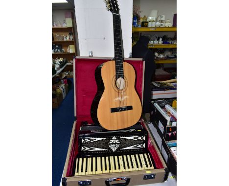 A GERALDO DE LUXE PIANO ACCORDIAN WITH CASE, together with a Chinese Burswood classical acoustic guitar and a Dolmetsch recor