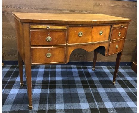 MAHOGANY BOW FRONT SIDEBOARD OF REGENCY DESIGN the central frieze drawer flanked by two short drawers and two pull out slides