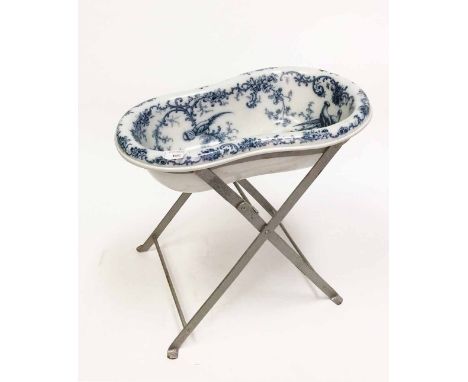 CAULDON BLUE AND WHITE CERAMIC BIDETtransfer decorated with birds and scrolling foilage, on a folding metal stand