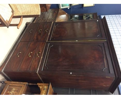 GEORGE III MAHOGANY LINEN PRESSthe interior with four sliding shelves above two short drawers, enclosed by two panel doors, a