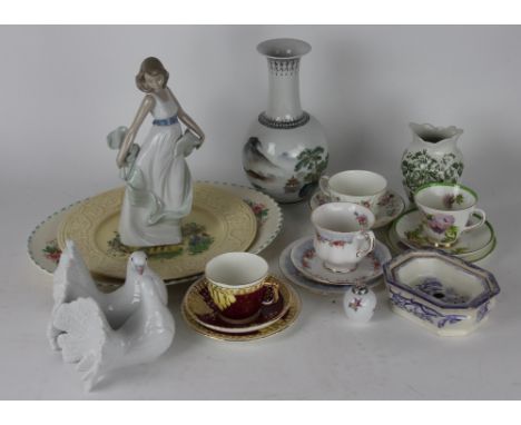 A Lladro group of two white doves, boxed, a Nao figure of a dancer, boxed, a 19th century printed soap dish and base decorate