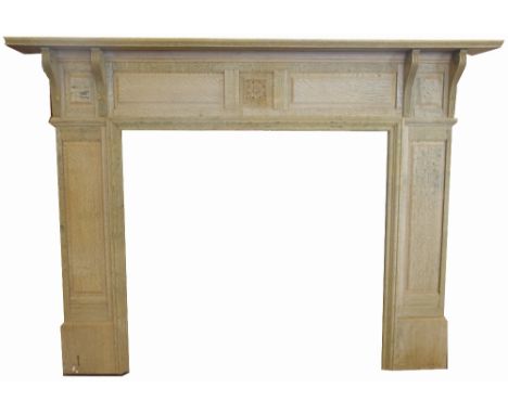 A carved light oak fire surround, 176cm x 132cm overall