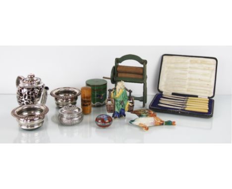 An Indian white metal powder box and cover, with foliate detailing, a pair of 19th century silver plate wine coasters, a Mauc