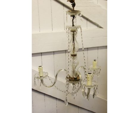 A French glass three branch ceiling light, with baluster column and glass lustre drops, 67cm high