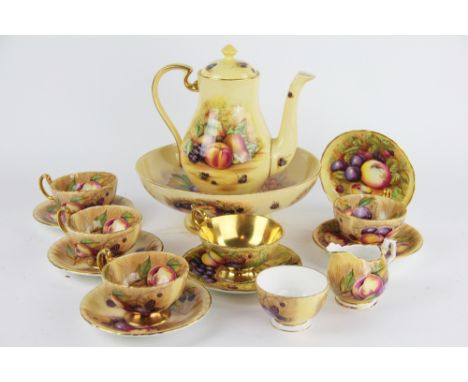 An Aynsley China fruits pattern bowl, coffee pot, sugar jug, milk jug, pedestal bowl, four cups and saucers and a larger cup 