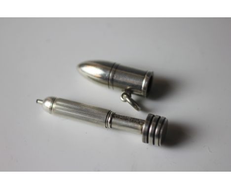 A Sampson Mordan and Co novelty silver 'bullet' propelling pencil, the casing with loop revealing the pencil with engine turn