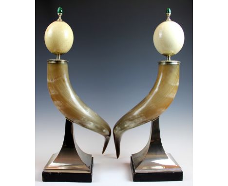 A pair of Anthony Redmile ostrich egg and bovine horn plate mounted ornaments, each with a polished malachite finial upon an 