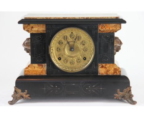 A Seth Thomas American faux marble mantel clock, with movement striking on a gong, the case back with original label 27.5cm x
