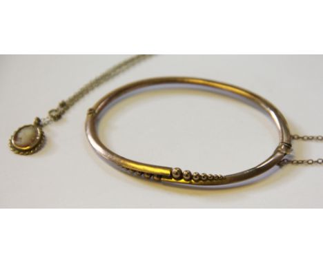 A 9ct gold hinged bangle and a cameo pendant and chain (2)