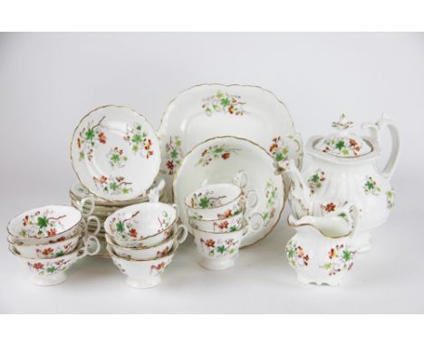 A 19th century Rockingham style twenty three piece part tea service, painted with flowers