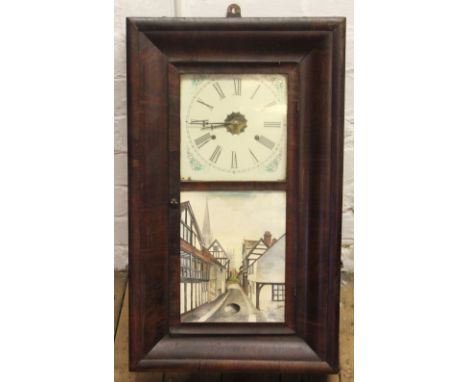 An American walnut wall clock by Jerome and Co, with movement striking on a gong, 66cm