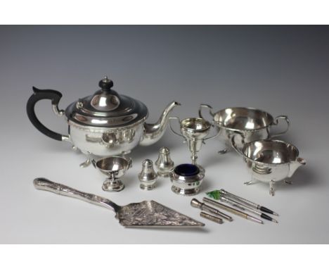 A pair of silver condiments, two small silver trophies, a three piece Mappin and Webb plated tea service and other plated ite