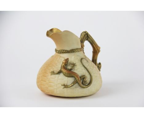 A Royal Worcester blush ivory lizard jug dated 1917,  the basket weave moulded body with applied lizard and branch effect han