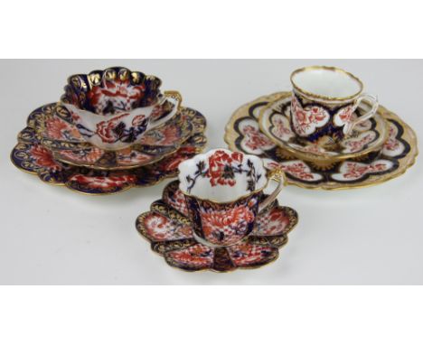 A Foley China Wileman Shelley trio and matching coffee cup and saucer, of serpentine form and decorated in an Imari pallet, w