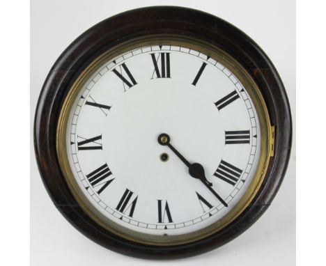 A stained pine wall clock, Roman numeral dial with brass bezel, 39cm diameter